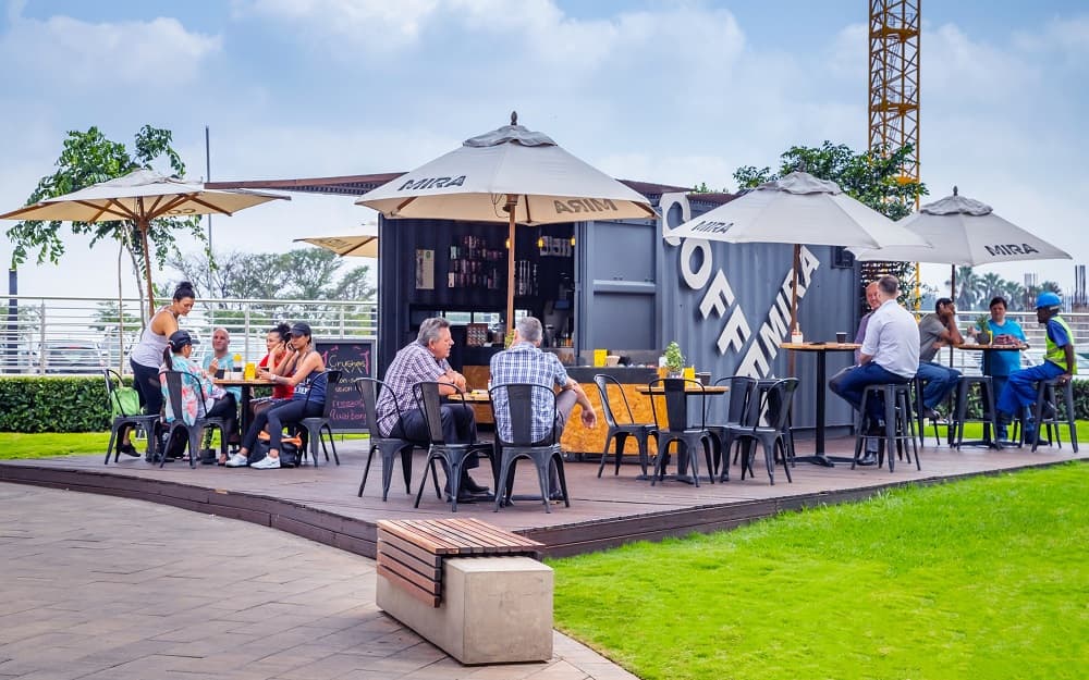 A shipping container cafe at a marina